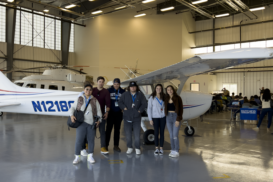 Aviation Students standing in front of airplane