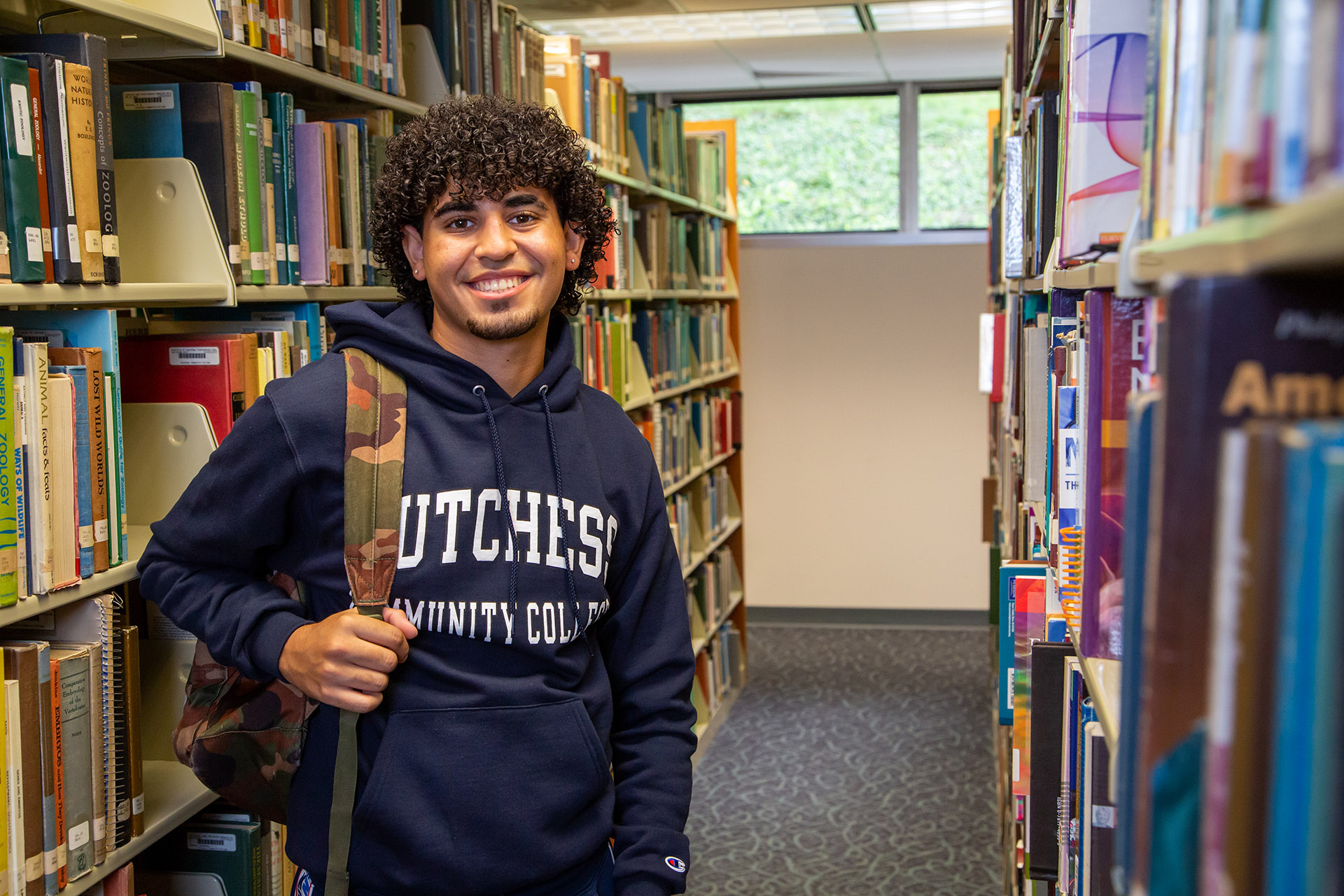 A student standing in the library